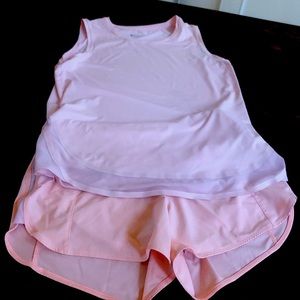 Peach colored Athleta shorts and tank top